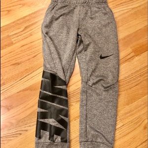 Nike DRI-FiT joggers gray with black nike symbol